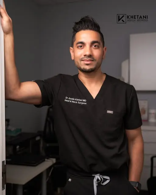 An Instagram photograph of Dr. Justin Khetani in surgical scrubs at the clinic.