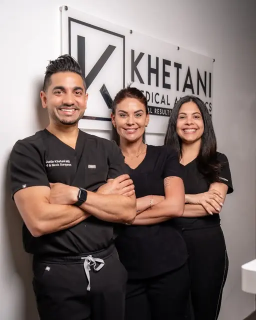 An Instagram photograph of three members of the practice team standing together under the clinic sign.