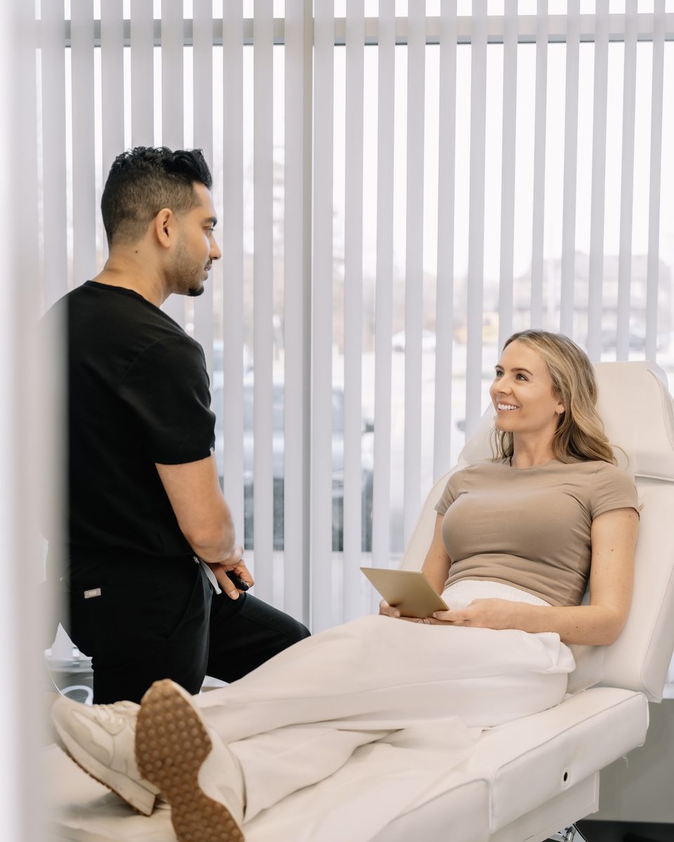 Dr. Justin Khetani in conversation with a patient in the Burlington clinic's treatment room