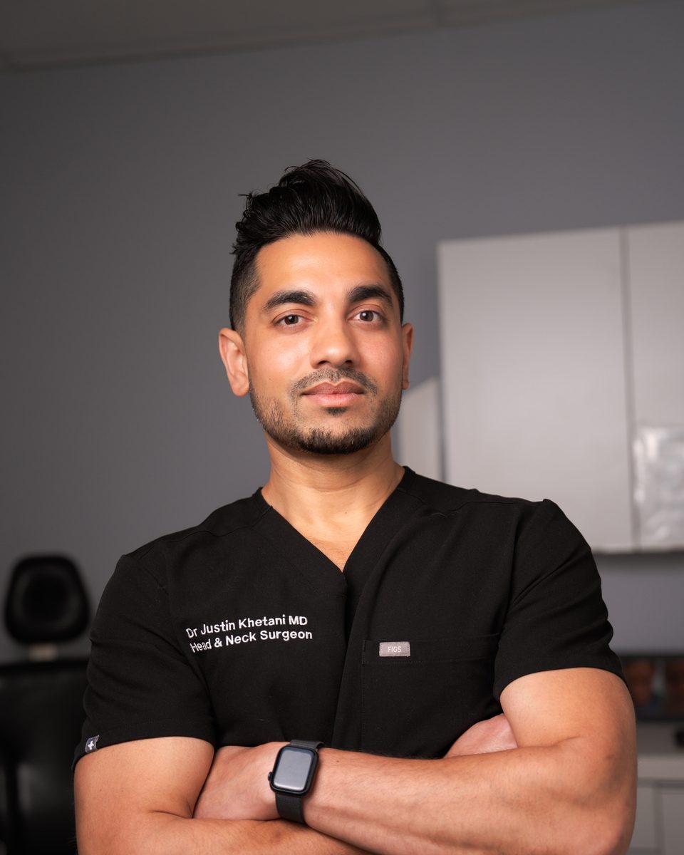 Portrait of Dr. Justin Khetani in a clinical consultation room