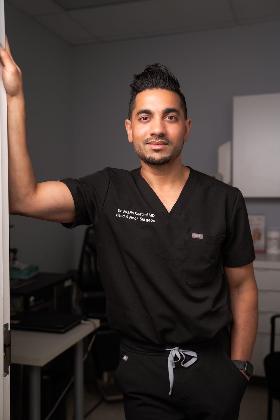 Dr. Justin Khetani at the door of an examination room in the Burlington clinic